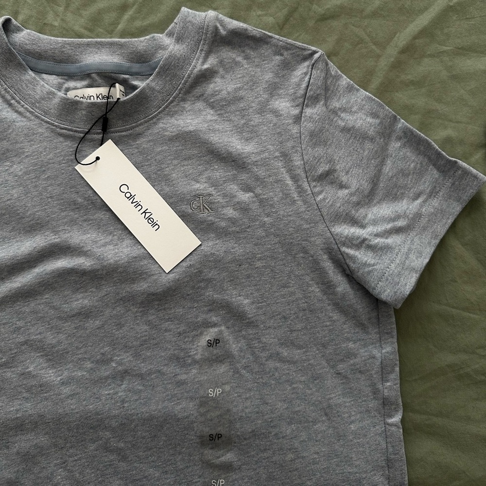 Women’s top color: light blue- Size: S - Brand: Calvin Klein